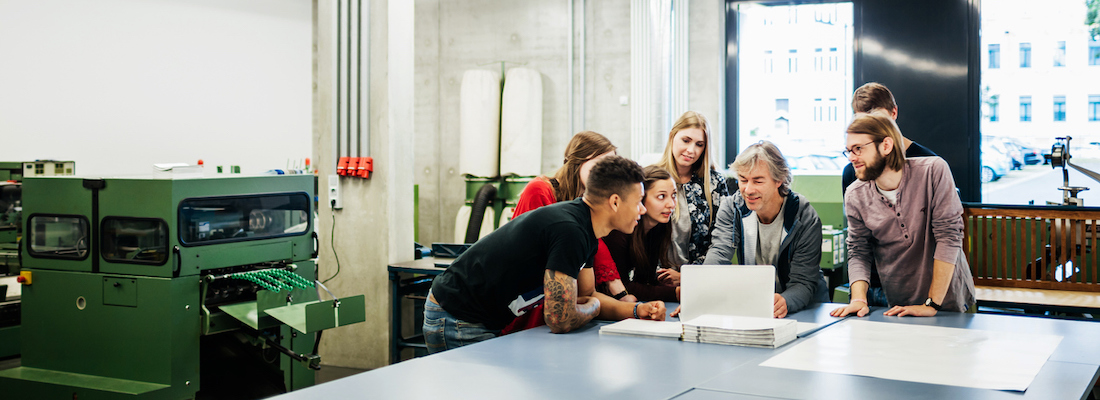 Students in an online technical college at an in-person seminar